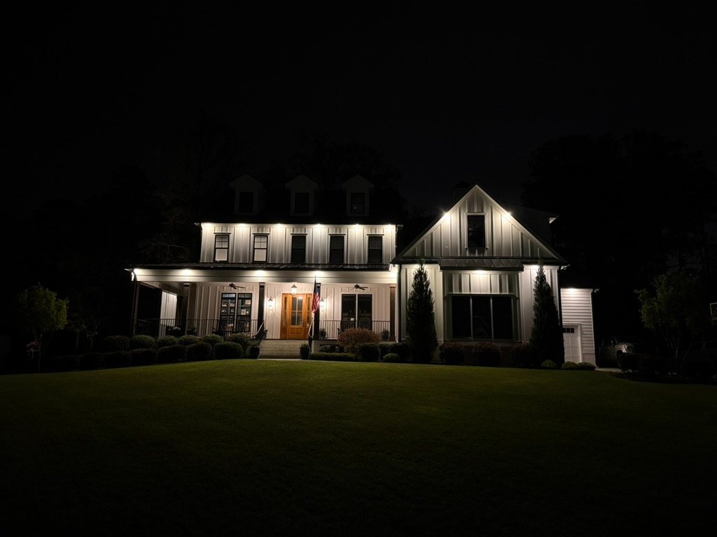 Home security and architectural exterior lighting at dusk