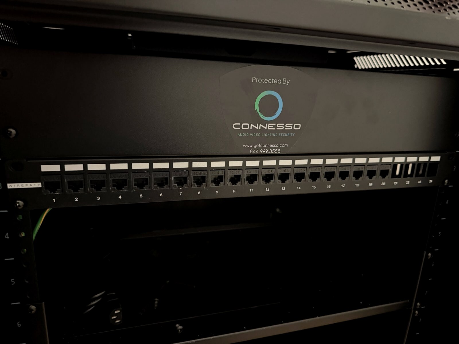 Connesso-branded network rack and Cat6 patch panel